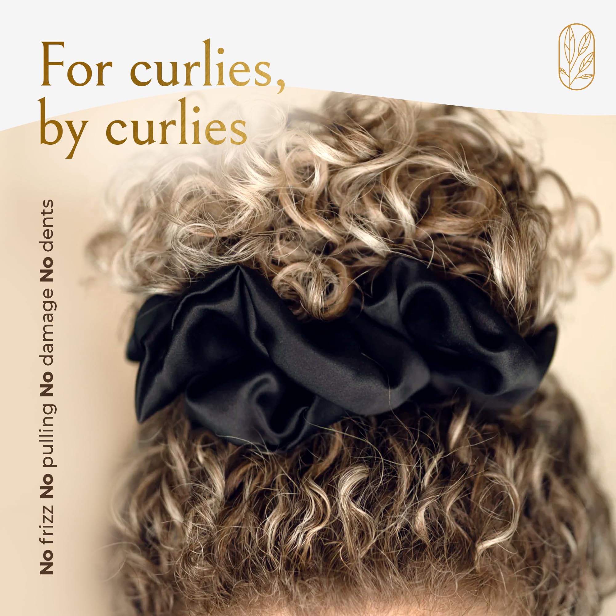 Curlfriend scrunchie held in hand illustrating oversized stretch and scale