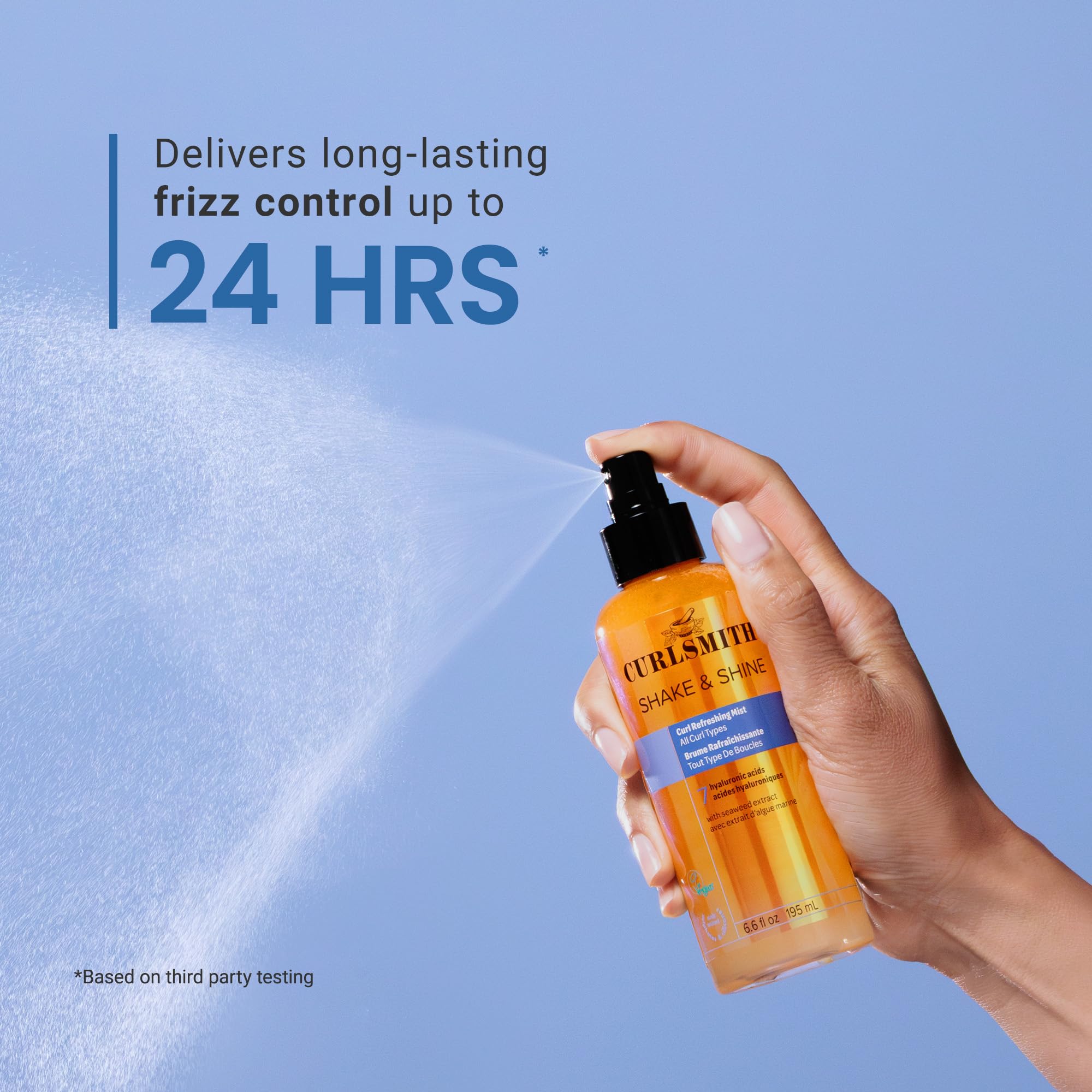 CURLSMITH misting across curly hair to refresh pattern and add shine