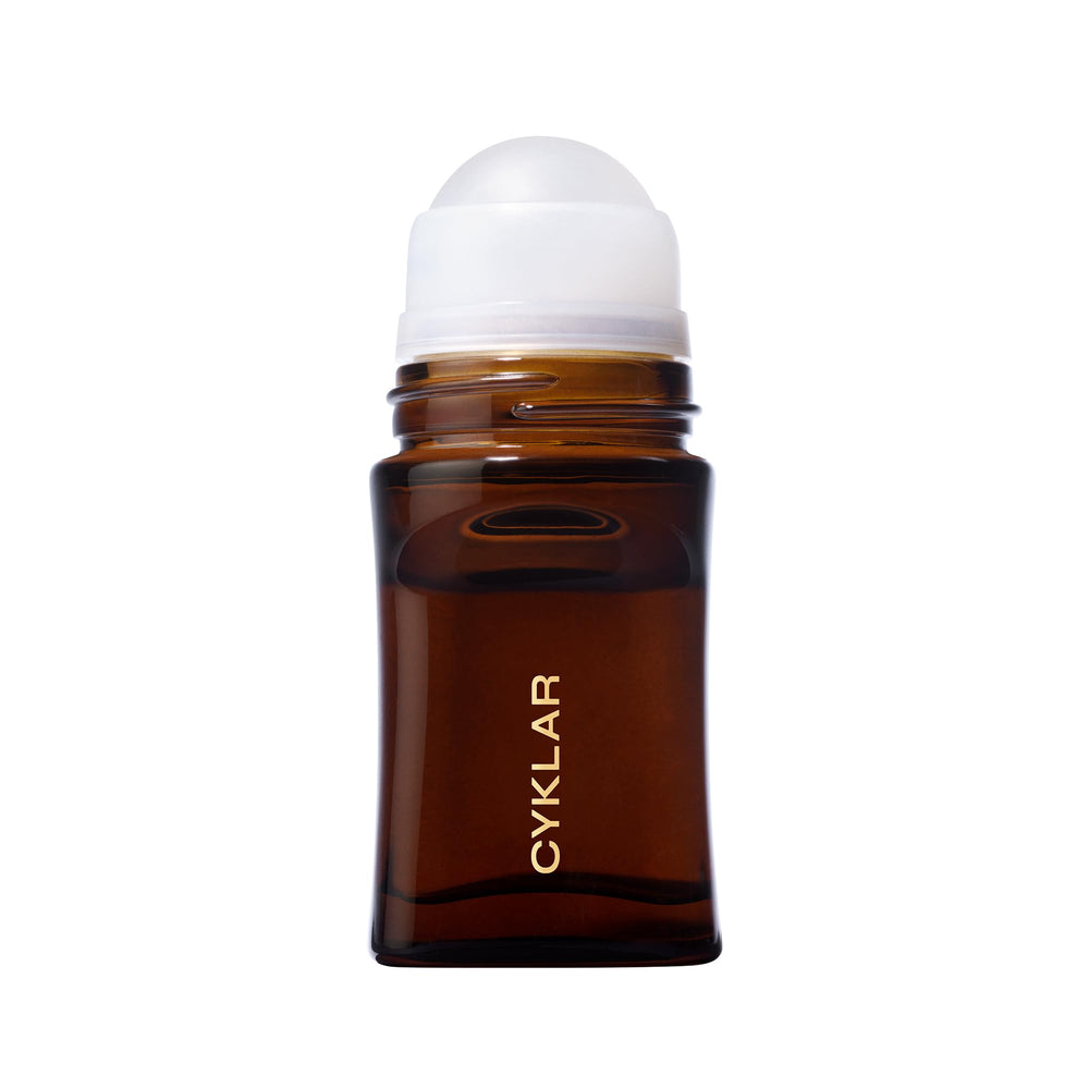 CYKLAR scent notes visual with amber and cardamom highlighting warm fragrance