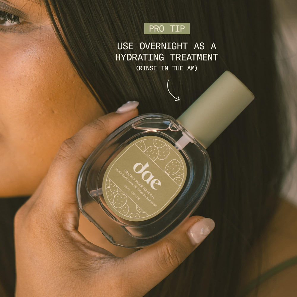 DAE bottle in hand showing size and easy portability for touch-ups