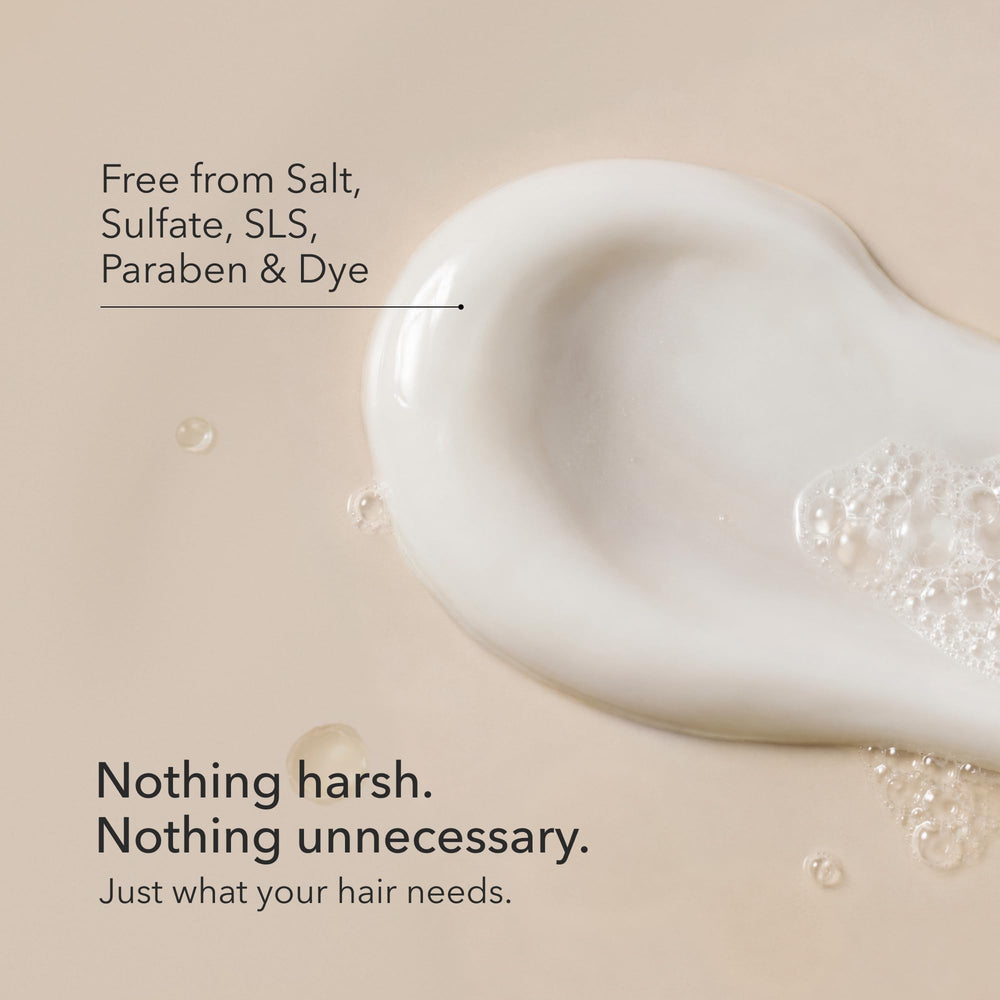 Daily Perfection shampoo on hand illustrating smooth application and spread