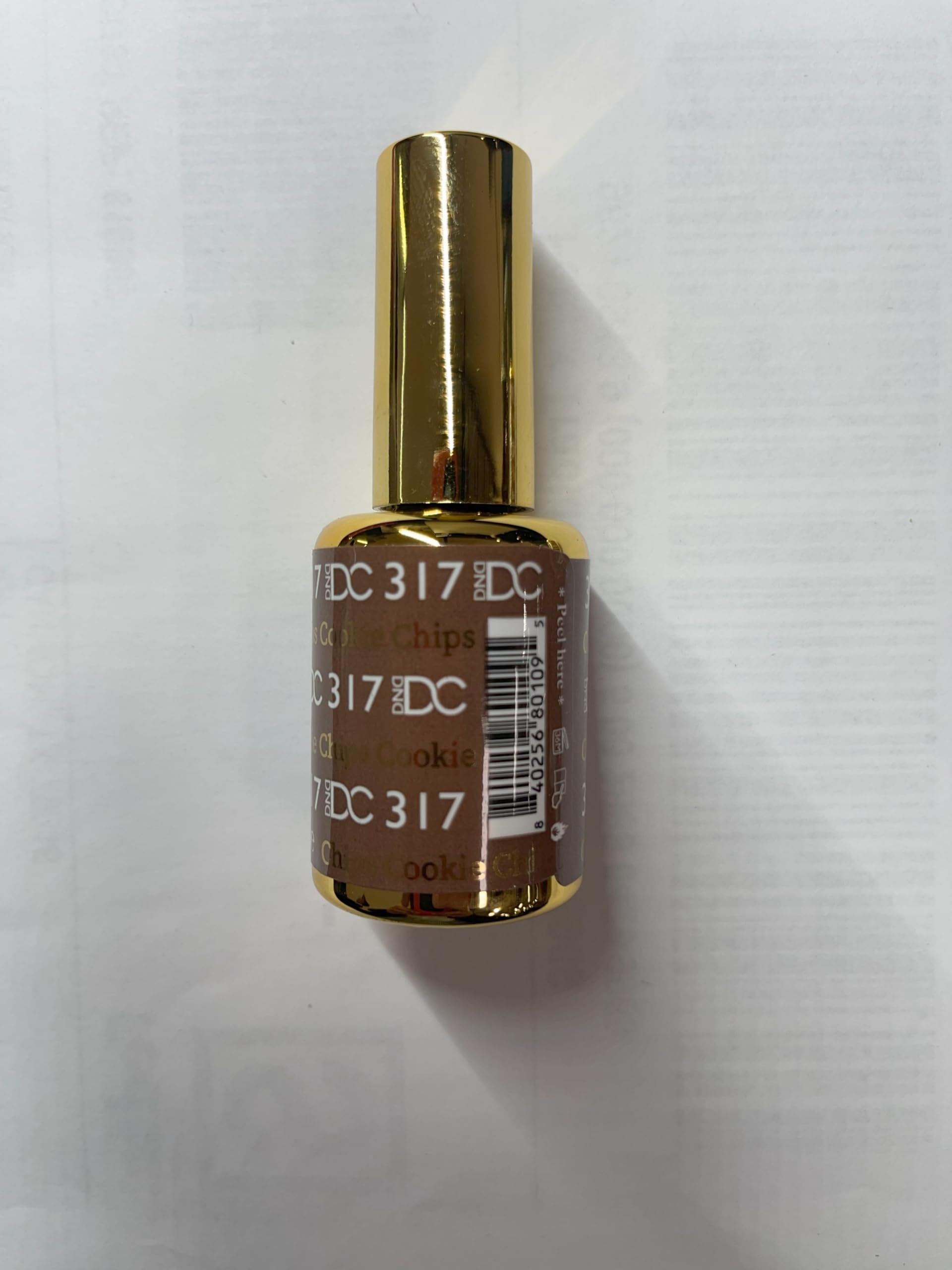 DAISY DND bottles beside ruler to show true 15ml size