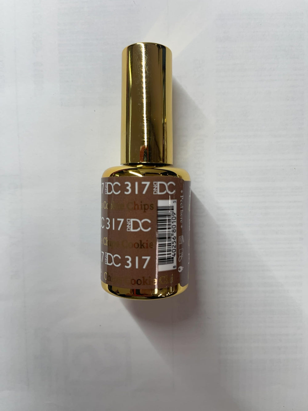 DAISY DND bottles beside ruler to show true 15ml size