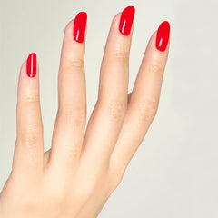 DAISY DND bottle close-up of Ferrari Red gel polish, shows rich pigmentation