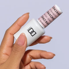 DAISY DND label close-up on bottle, clear shade name and ingredient benefit