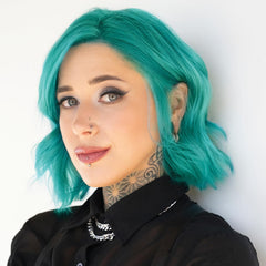 Danger Jones color swatch on blonde lock showing vibrant payoff