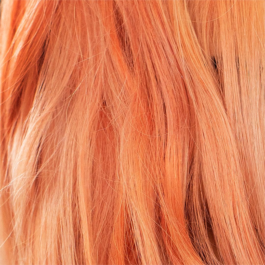 Danger Jones hairdresser applying Simpatico light peach for vibrant pastel results