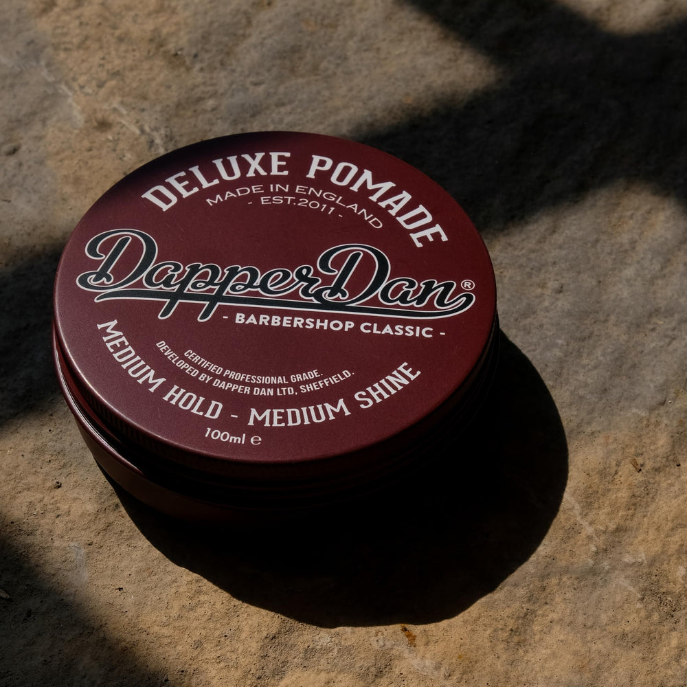 Dapper Dan jar on bathroom shelf in lifestyle scene suggesting daily grooming routine