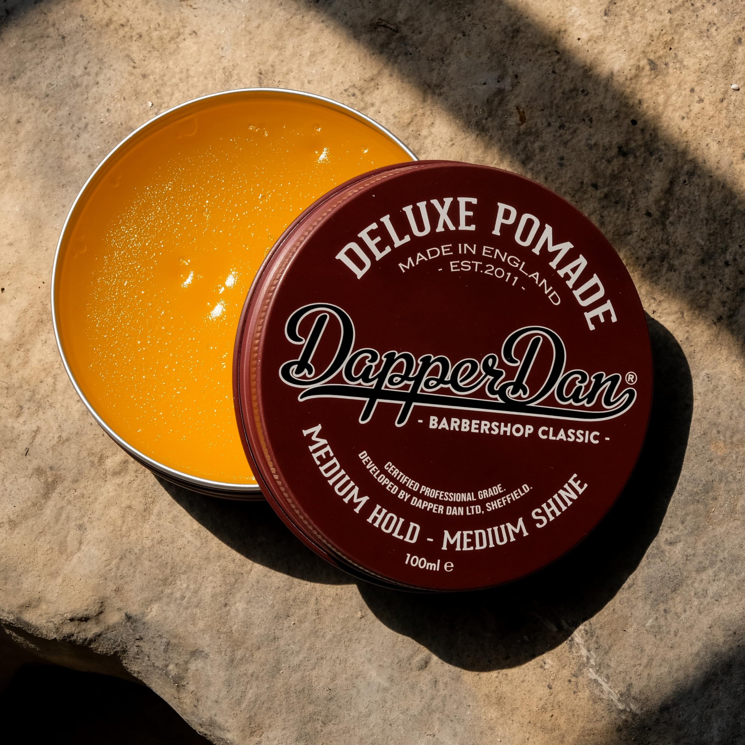 Close-up of Dapper Dan label showing product details and water-based benefit