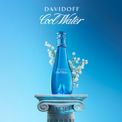 Davidoff Cool Water spritz near lily of the valley close-up conveying floral freshness