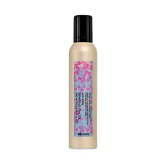 Davines product front packaging showing brand and curl mousse benefit