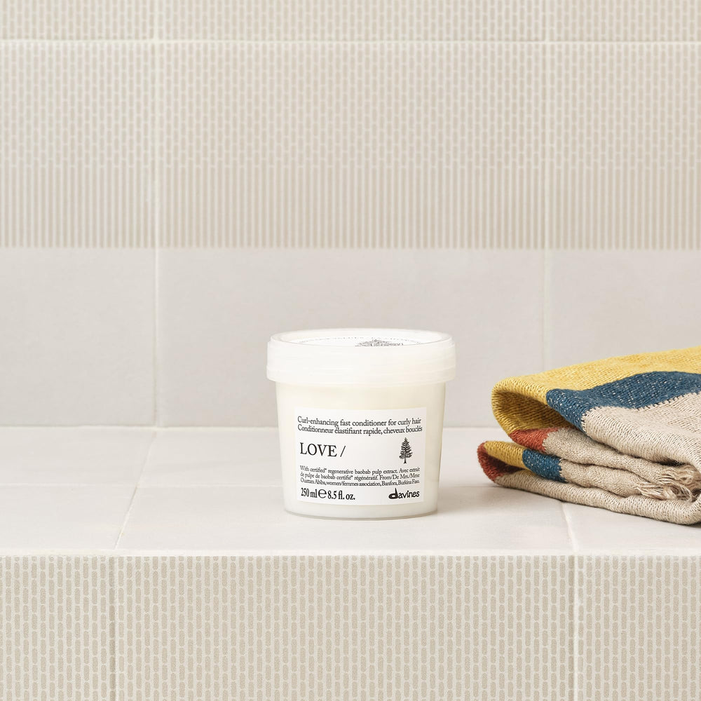 Davines bottle on shelf indicating brand and salon-quality presentation benefit