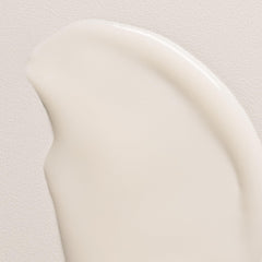 Davines bottle in hand dispensing cream to show amount needed and easy application