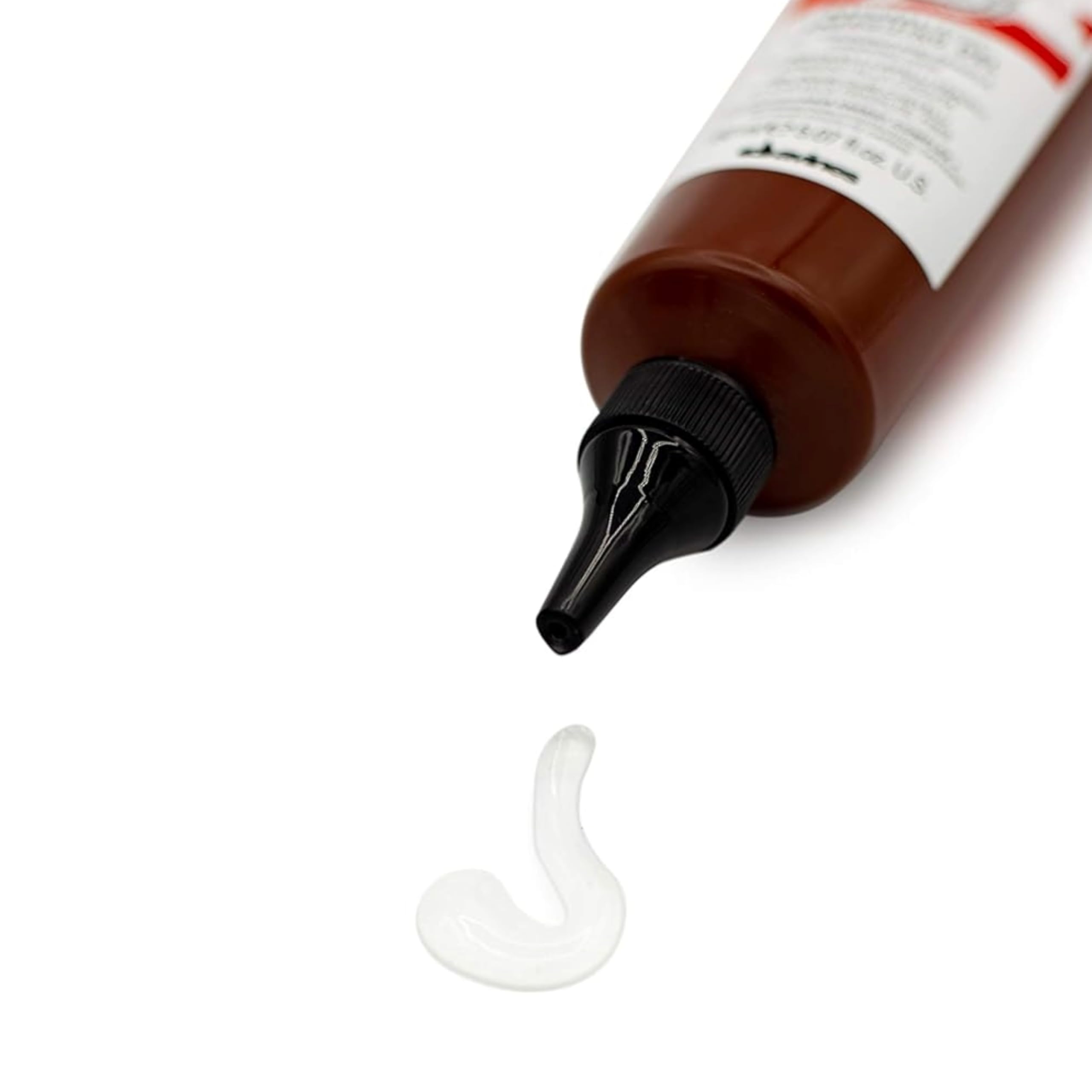Massaging Davines Naturaltech gel into scalp to soothe and support roots