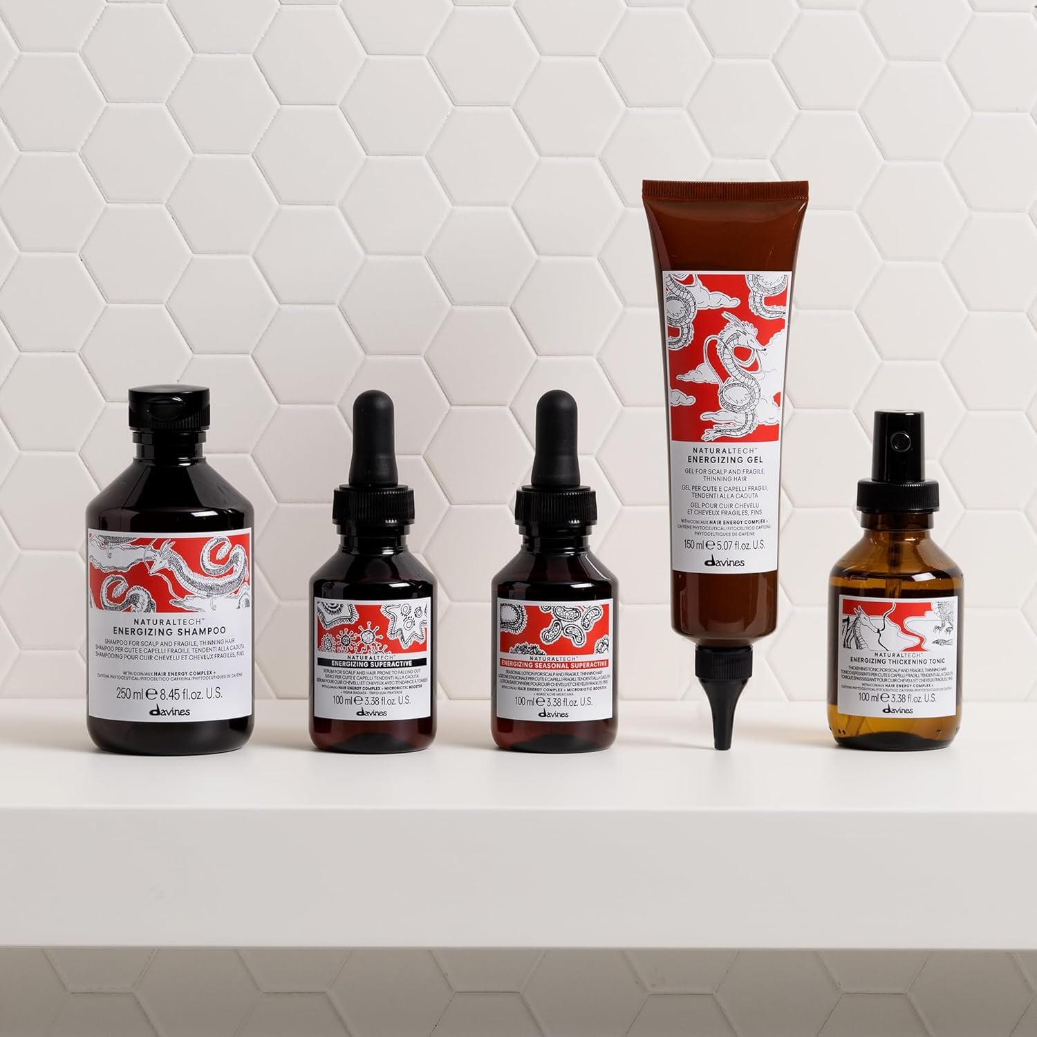 Davines bottle next to hand for size and scale, showing travel-friendly benefit