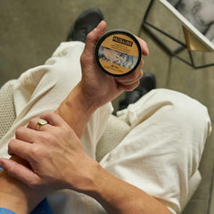 Davines product smeared on hands illustrating easy warming and spreadability