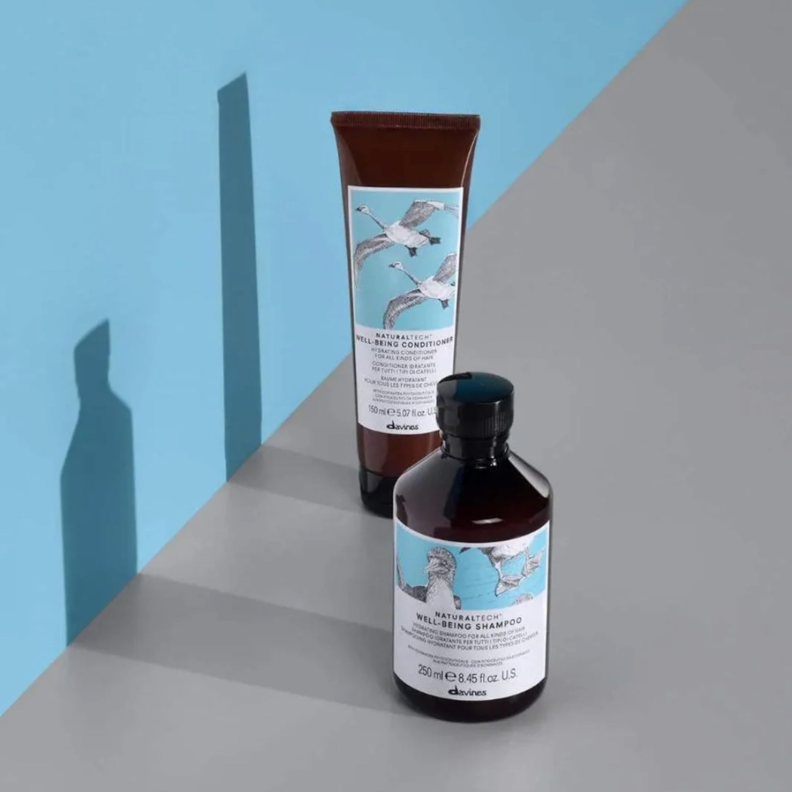 Davines wellbeing conditioner bottle in hand for size and scale convenience benefit