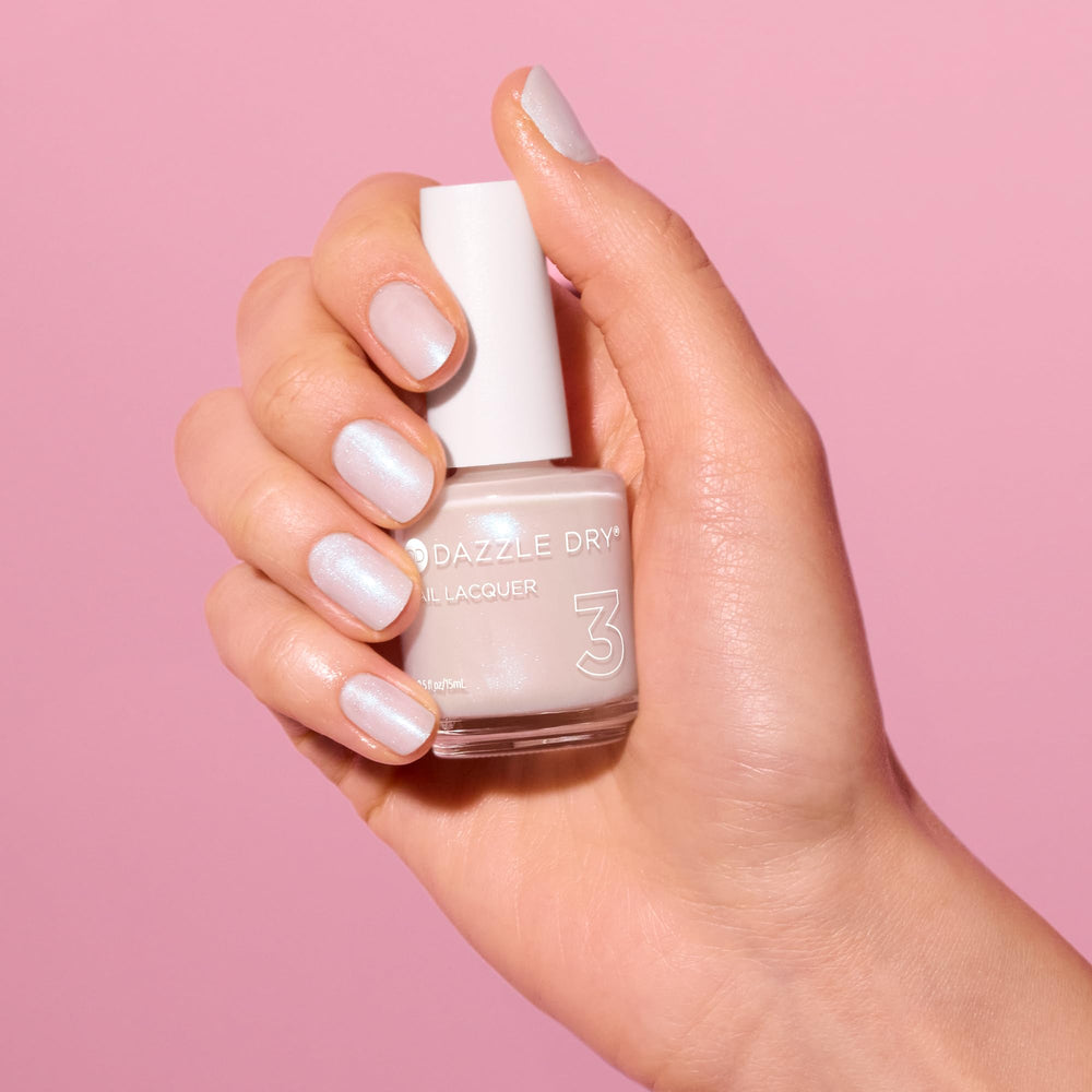 Dazzle Dry swatched on fingernails showing Artisan iridescent finish and wearable shine