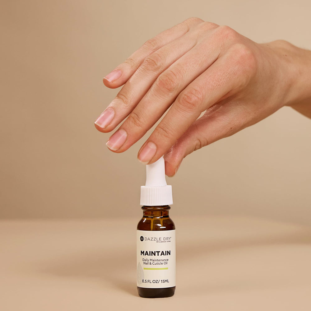Close-up of Dazzle Dry oil texture on skin, emphasizes fast absorption