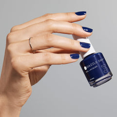 Dazzle Dry swatch on skin tone illustrating color payoff and flattering deep blue benefit