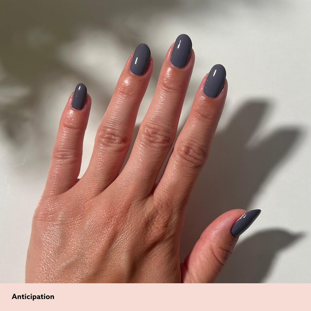 Applying Dazzle Dry Nail Prep with brush to natural nail for improved adhesion