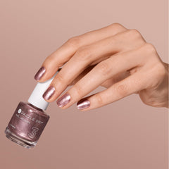 Dazzle Dry Out N' About swatch on nail wheel demonstrating full-coverage metallic payoff