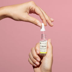Dazzle Dry dropper releasing Revive drops to thin lacquer quickly