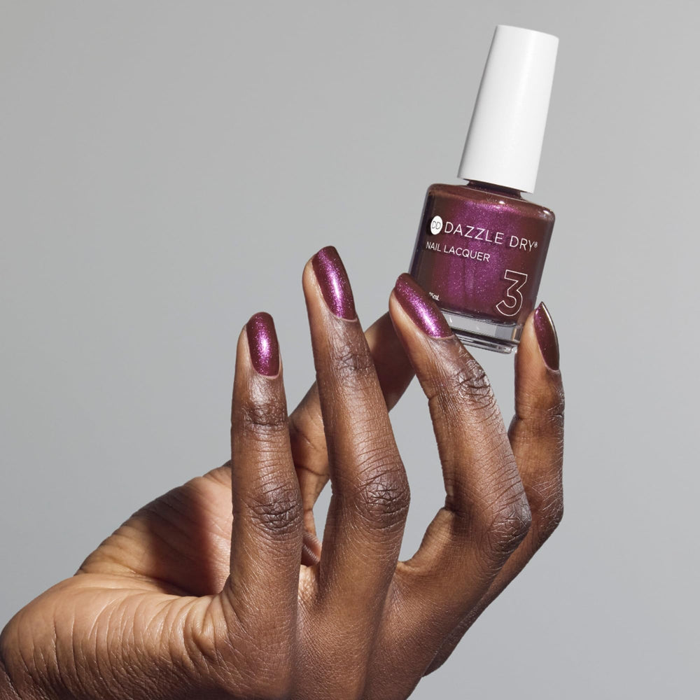 Dazzle Dry close-up of nails showing Spiced Plum shimmer and salon finish