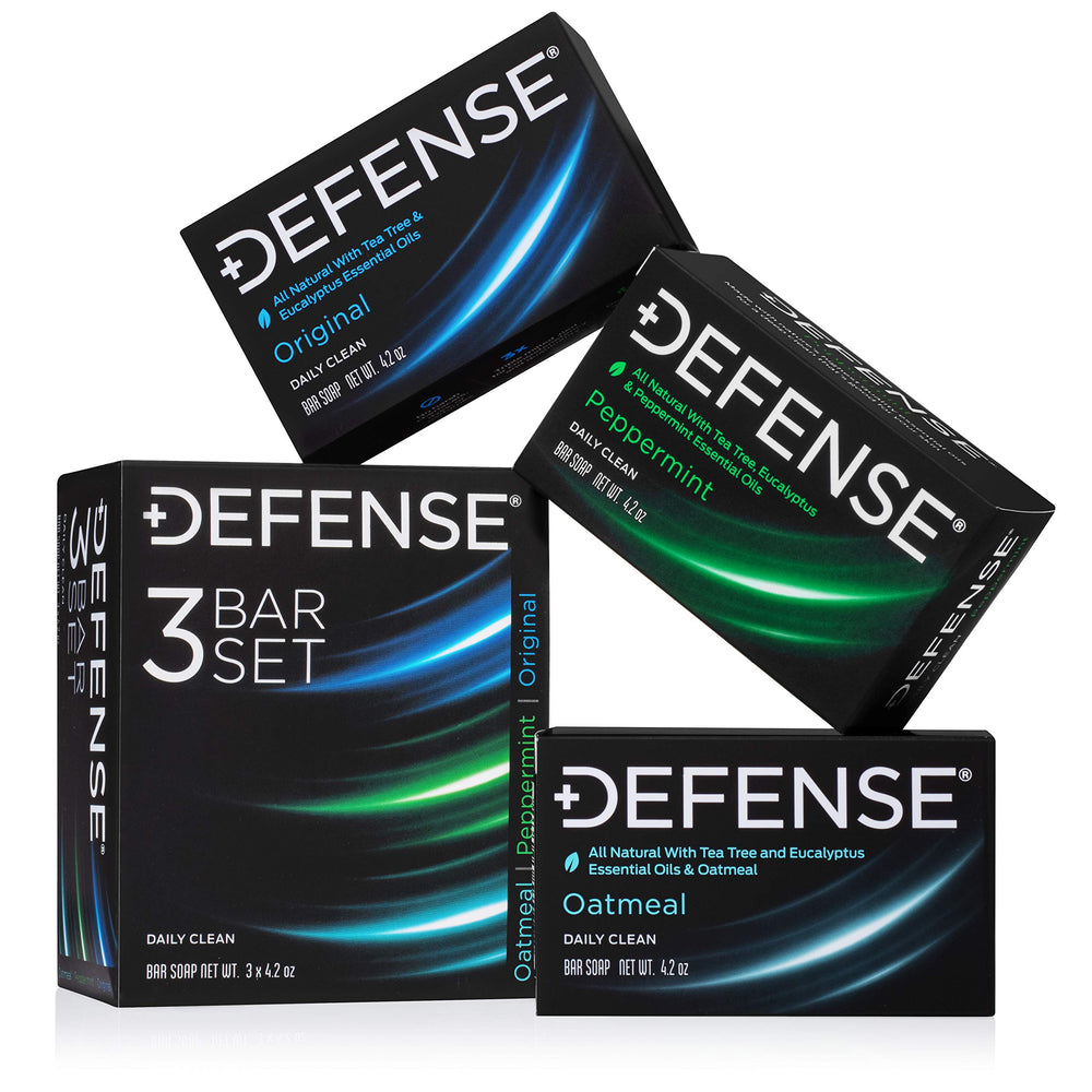 Defense Soap front packaging showing all three bars and benefits