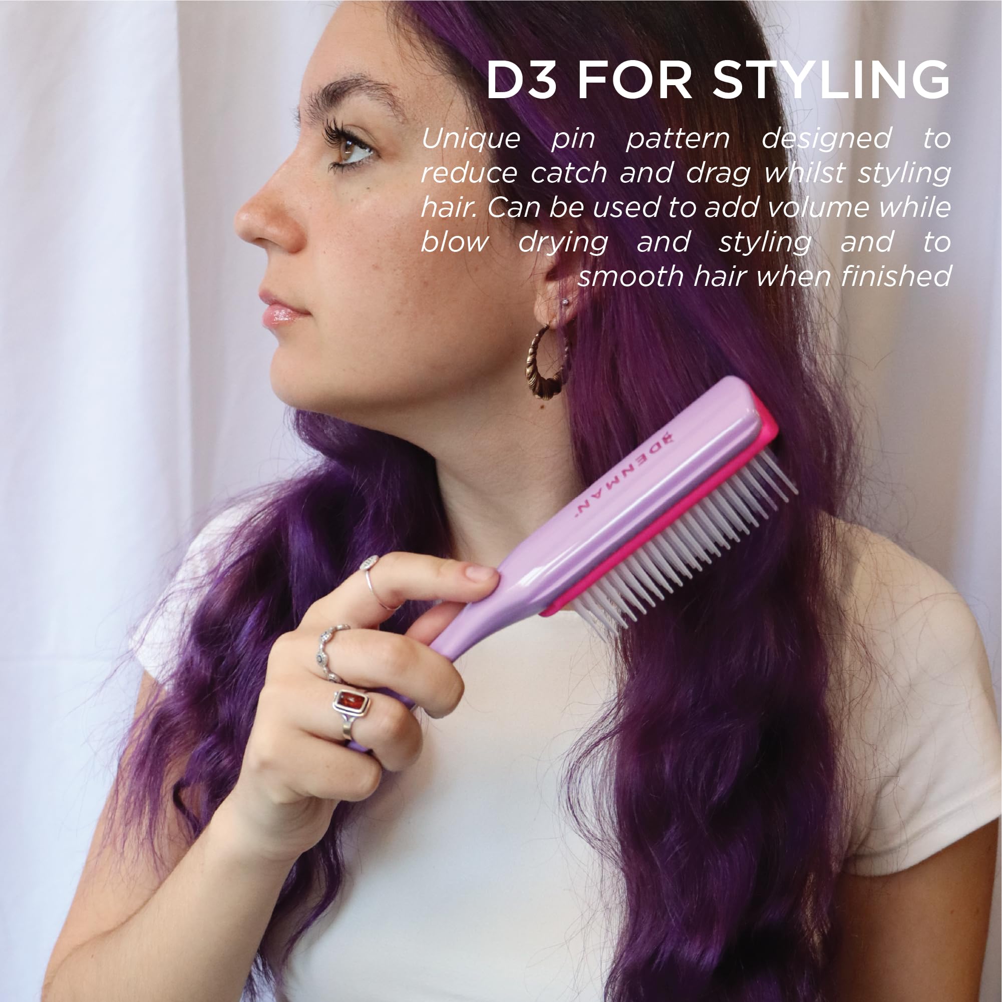 Denman D3 held in hand to show scale and control for styling
