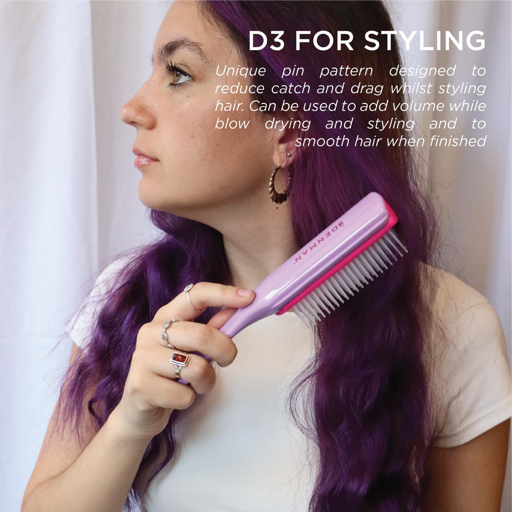 Denman D3 held in hand to show scale and control for styling