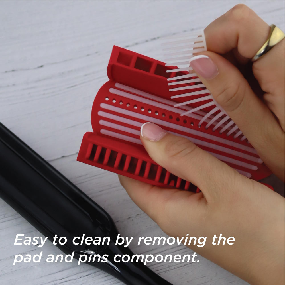 Denman D3 held in hand to show scale and how it fits various hand sizes