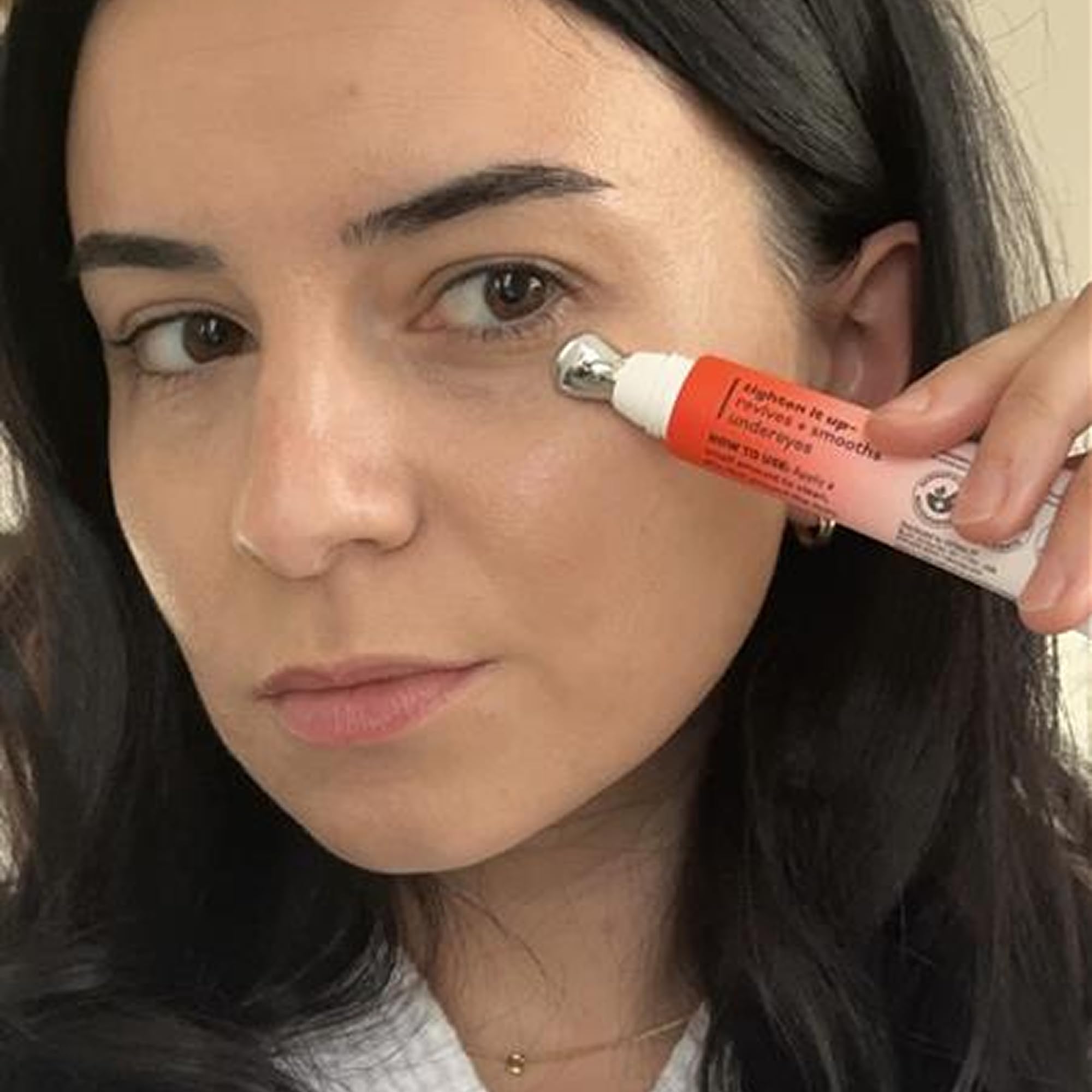 Derma E eye cream used in nighttime bathroom routine for restorative care