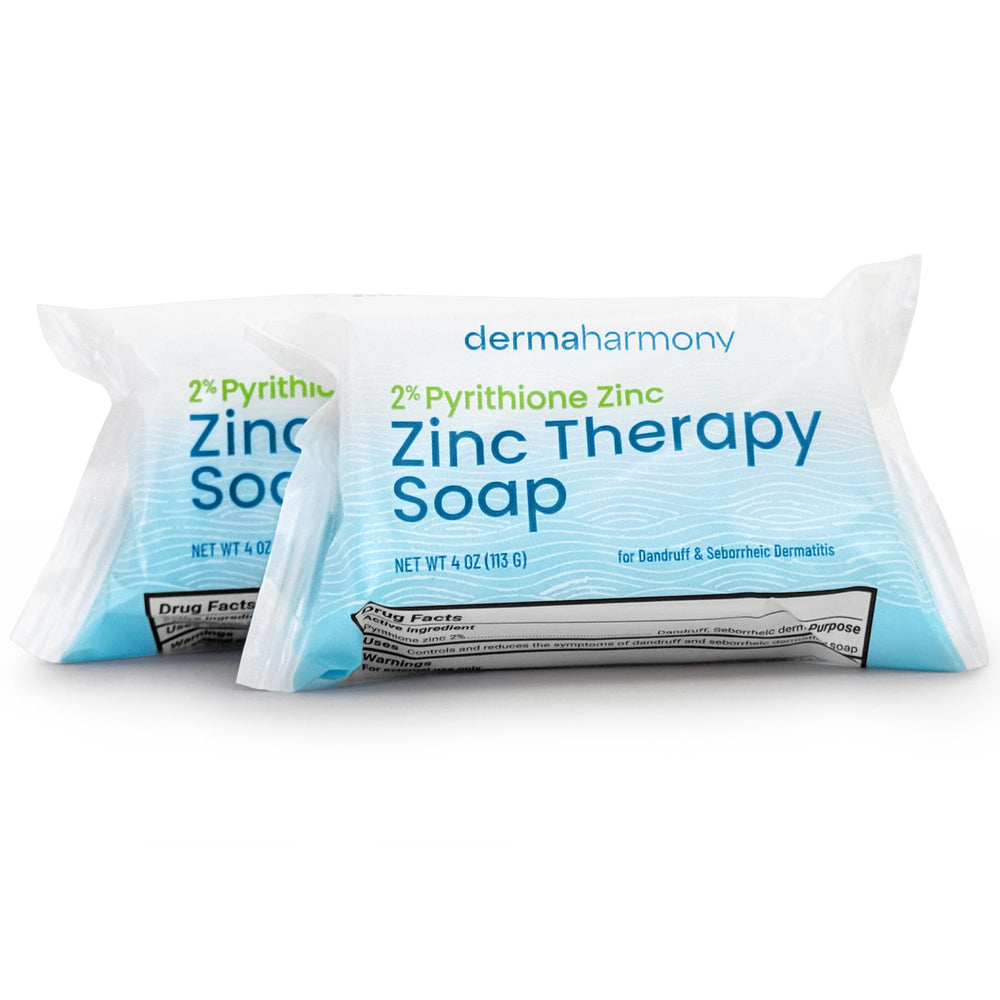 Dermaharmony lathered bar in hand demonstrating gentle cleansing action