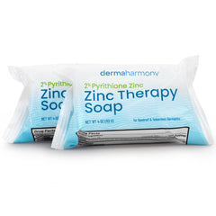 Dermaharmony lathered bar in hand demonstrating gentle cleansing action