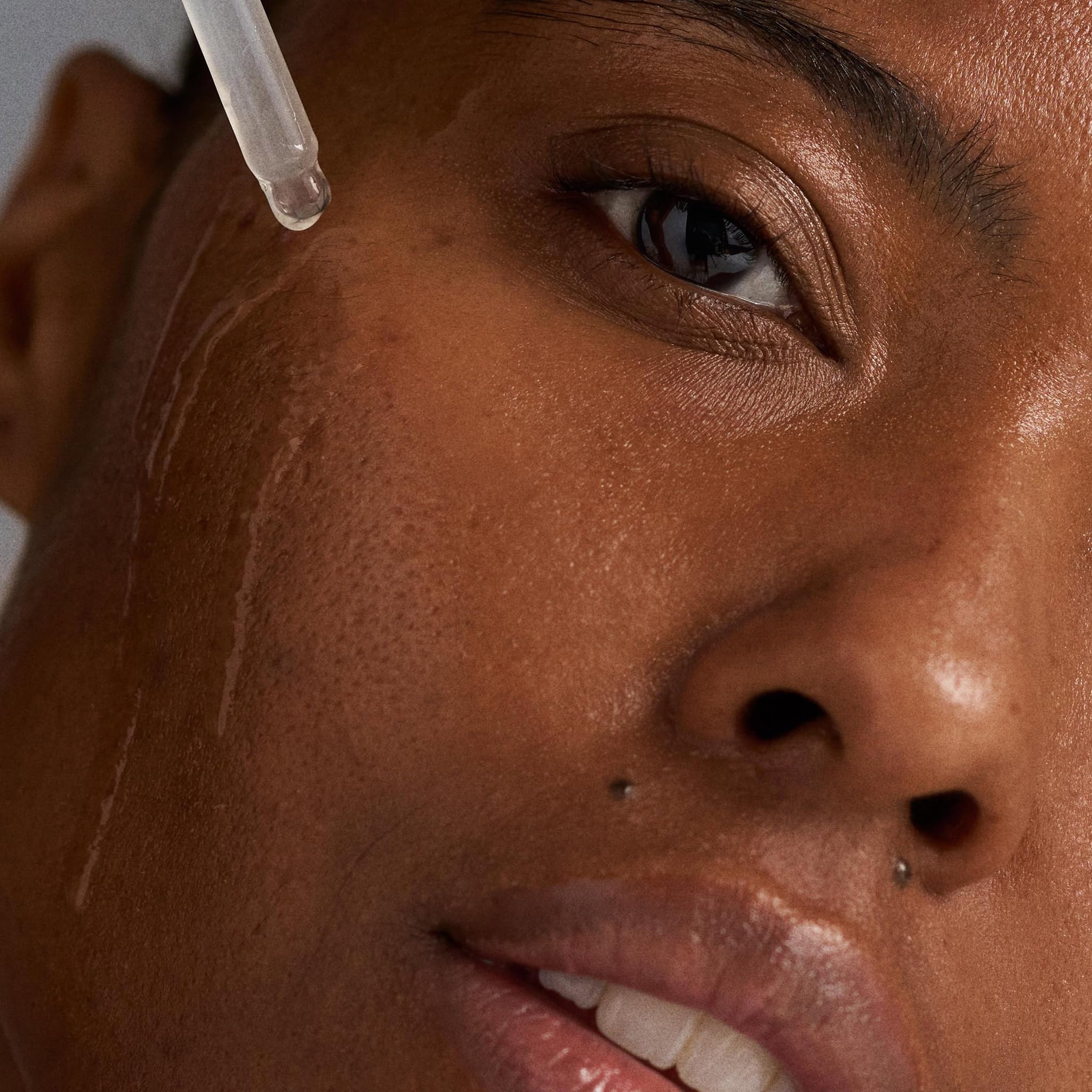 Dermalogica serum on skin drop illustrating hydration release and instant plumping benefit