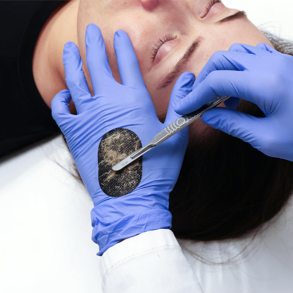 Dermapad texture close-up revealing black surface that holds debris clearly