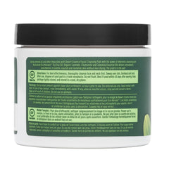 Desert Essence pad in hand to show scale and easy one-step cleansing benefit