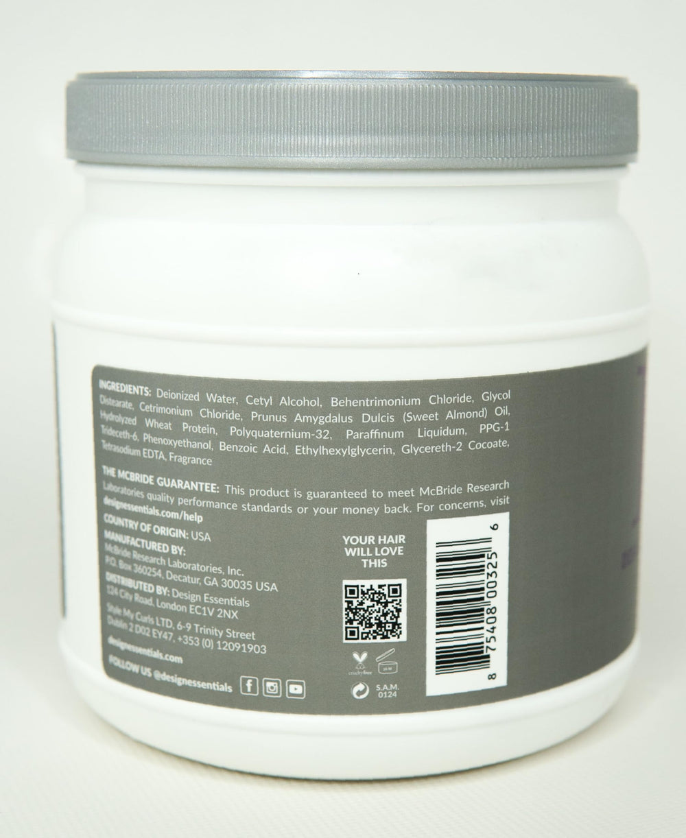 Design Essentials bottle held in hand for size comparison and easy dispensing during routines