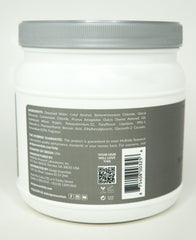 Design Essentials bottle held in hand for size comparison and easy dispensing during routines
