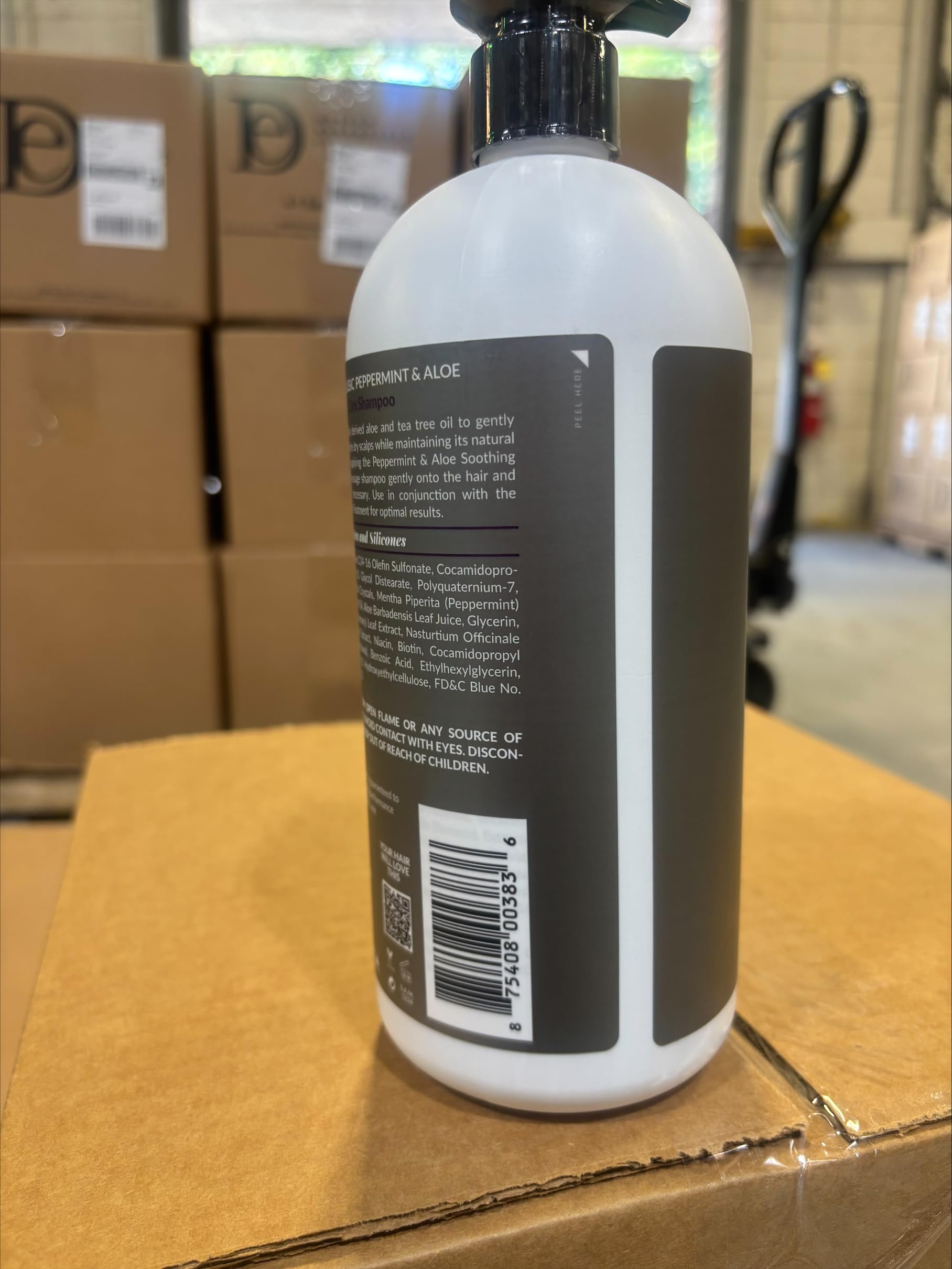 Design Essentials bottle next to common items showing 32 fl oz size