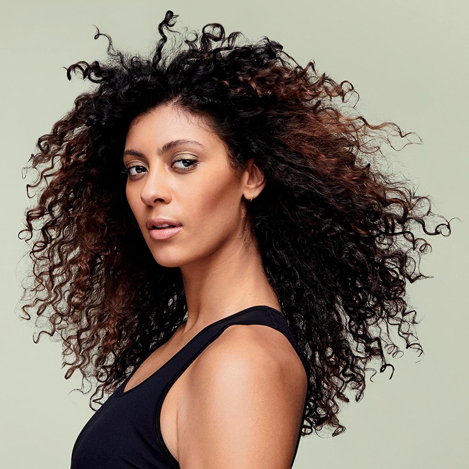 DevaCurl cleanser lather texture demonstrating gentle foam and effective slip