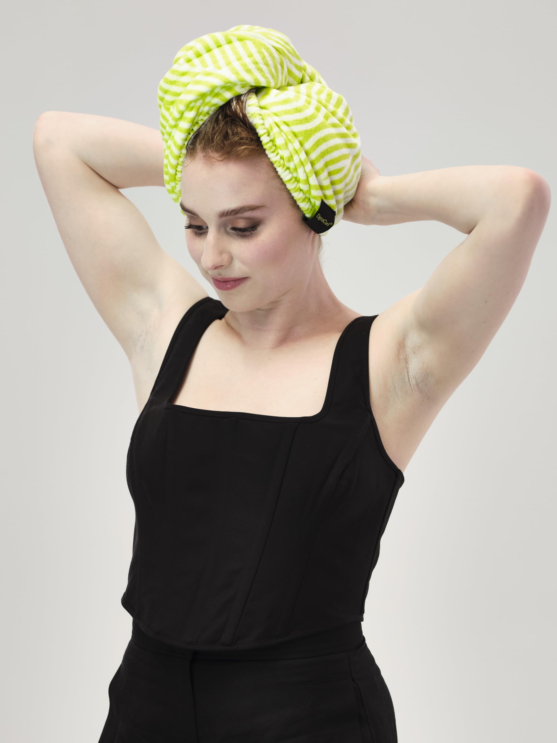 DevaCurl folded wrap showing compact storage and quick-dry benefit