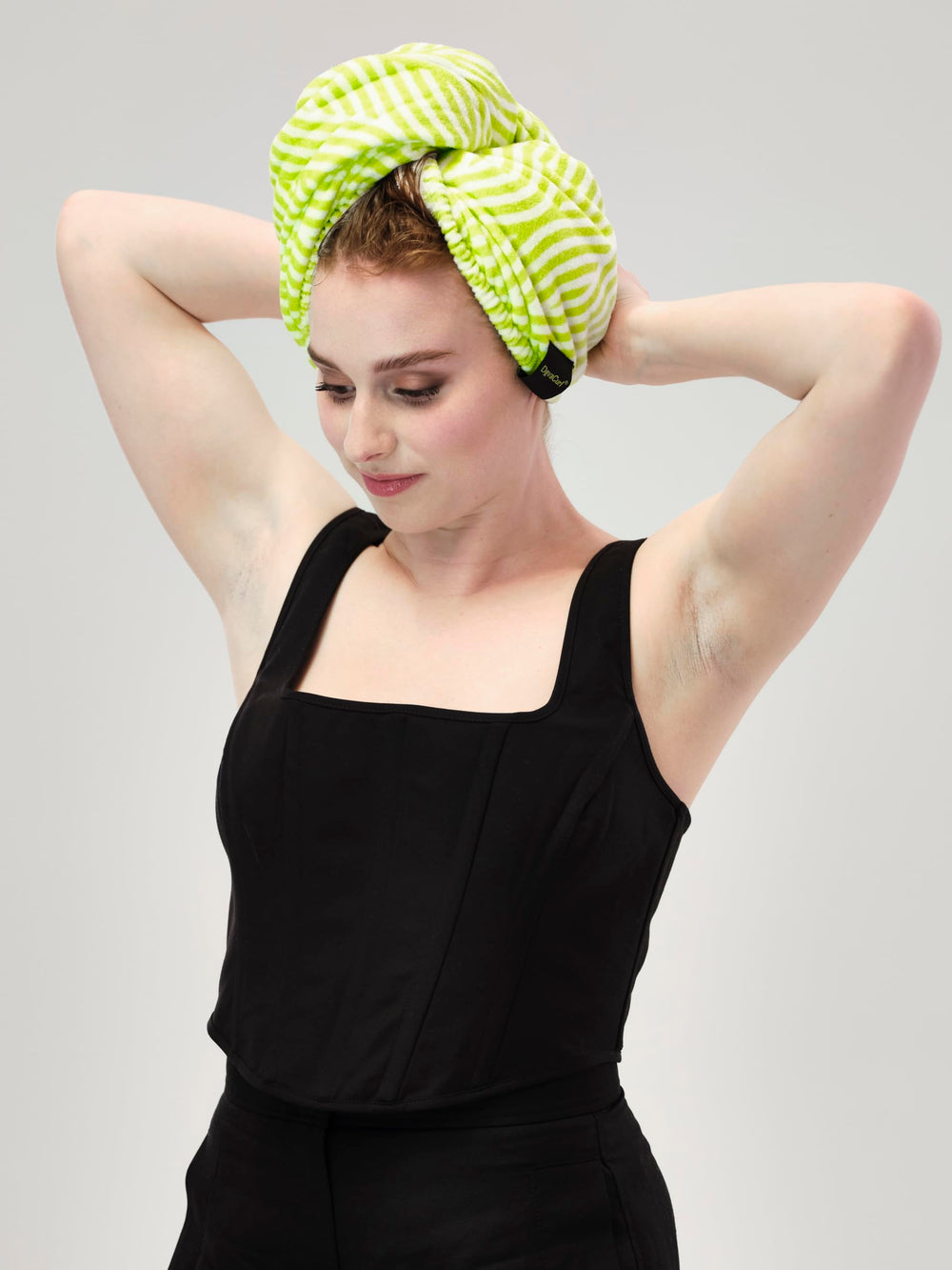 DevaCurl folded wrap showing compact storage and quick-dry benefit