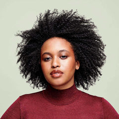 DevaCurl pump dispensing cream cleanser for easy, mess-free application