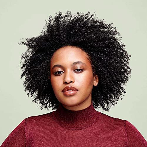 Side-by-side before and after curls using DevaCurl SuperCream highlighting reduced frizz