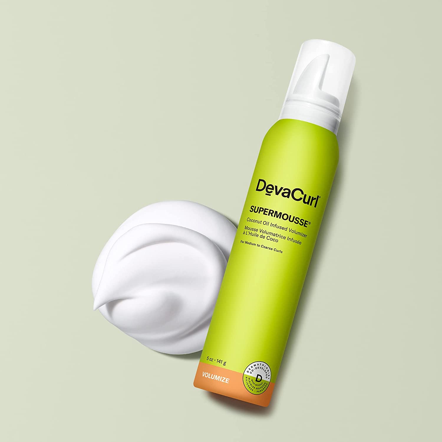 DevaCurl SuperMousse mousse texture on hand demonstrating creamy, buttery feel