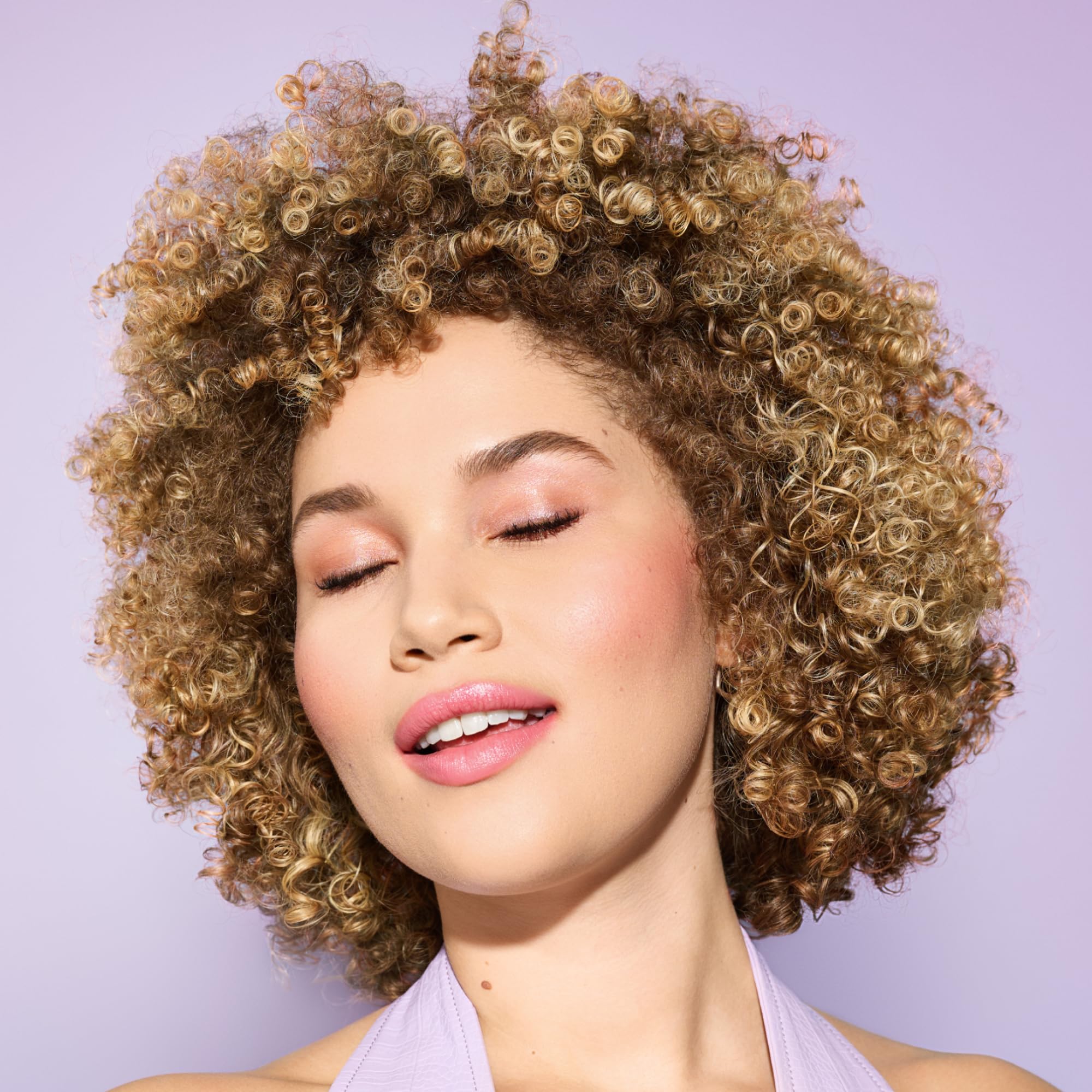 DevaCurl gel texture close-up showing smooth non-sticky formula and easy spreadability