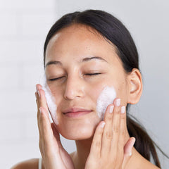 DHC foam in hand demonstrating gentle lather and cleansing action
