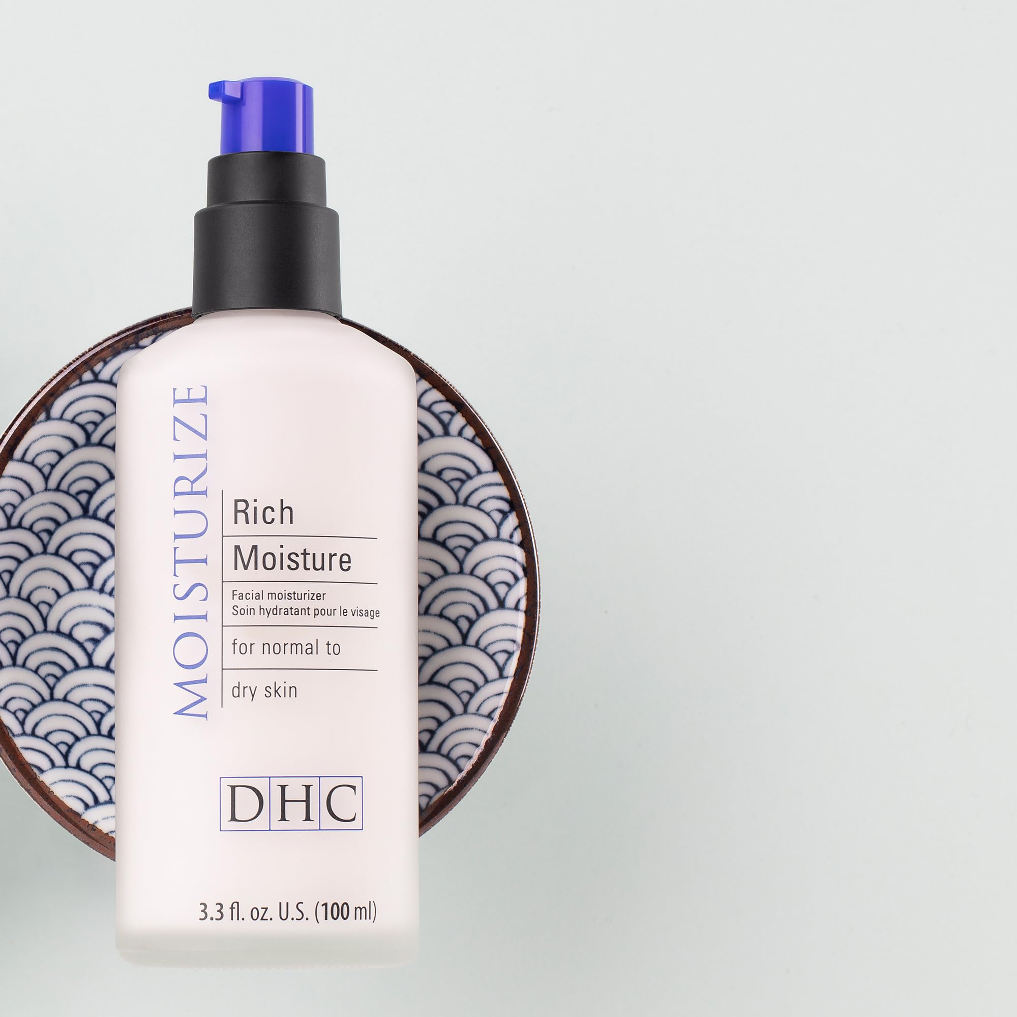 DHC moisturizer on bathroom vanity styled in a routine for daily use inspiration